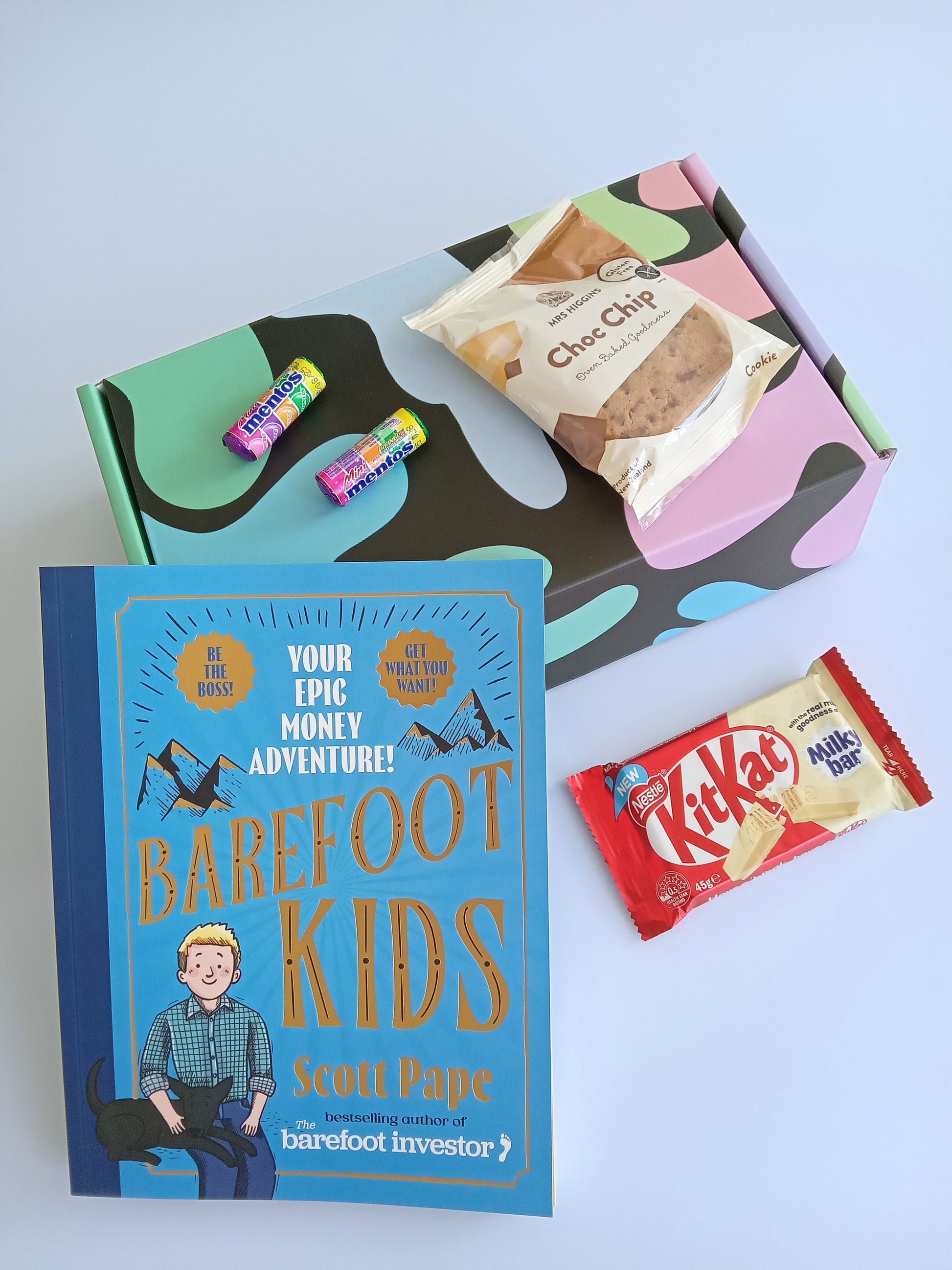 Kids gift box containing Barefoot Kids book, Kit Kat, Mrs HIggins Choc Chip Cookie and two mini Mentos rolls multi fruit flavours